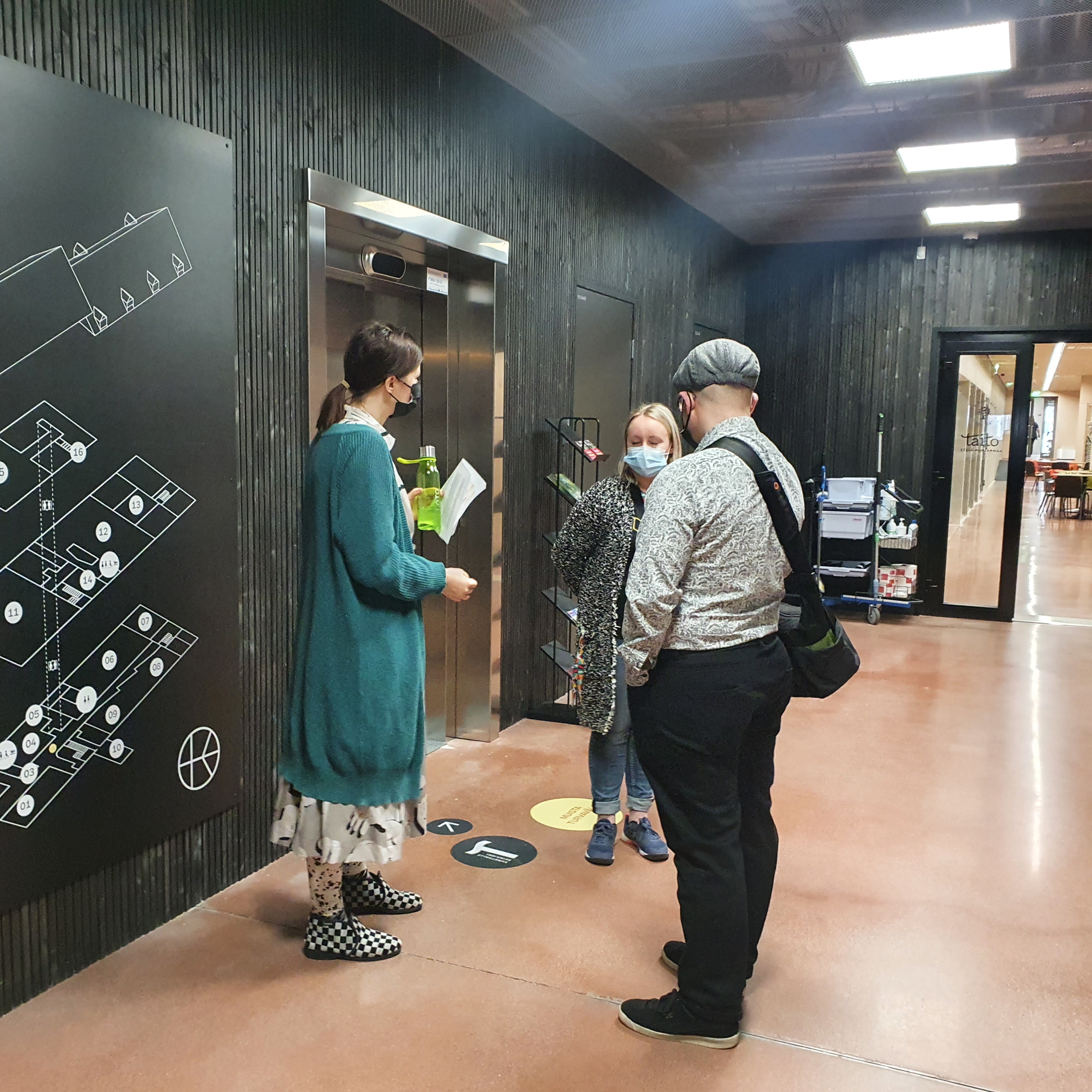 Päivi and Elina talking to Mark during the tour