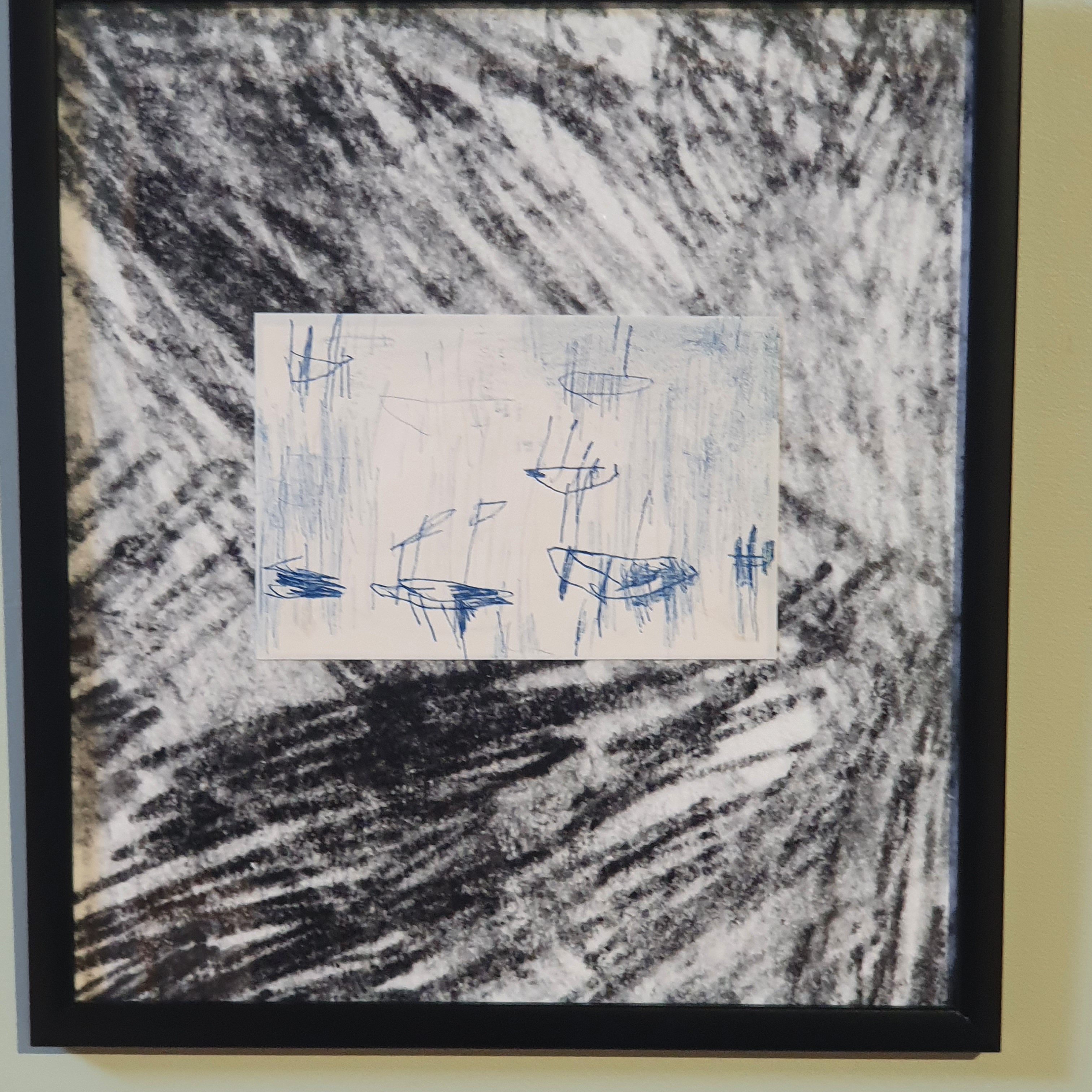 Artwork from the “Stump of Prometheus – Stay together” exhibition in a black frame