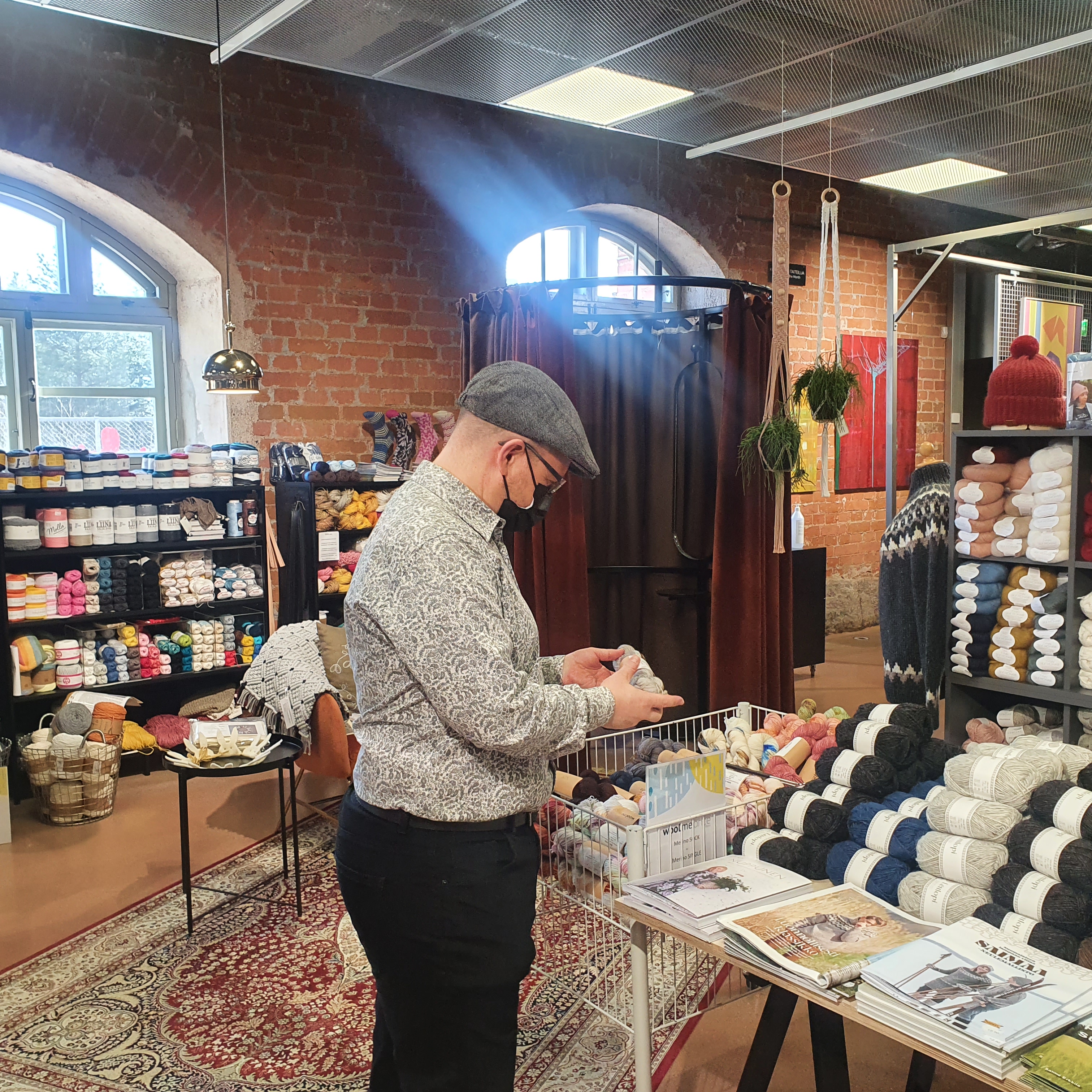 Mark looking at products in Taito Shop