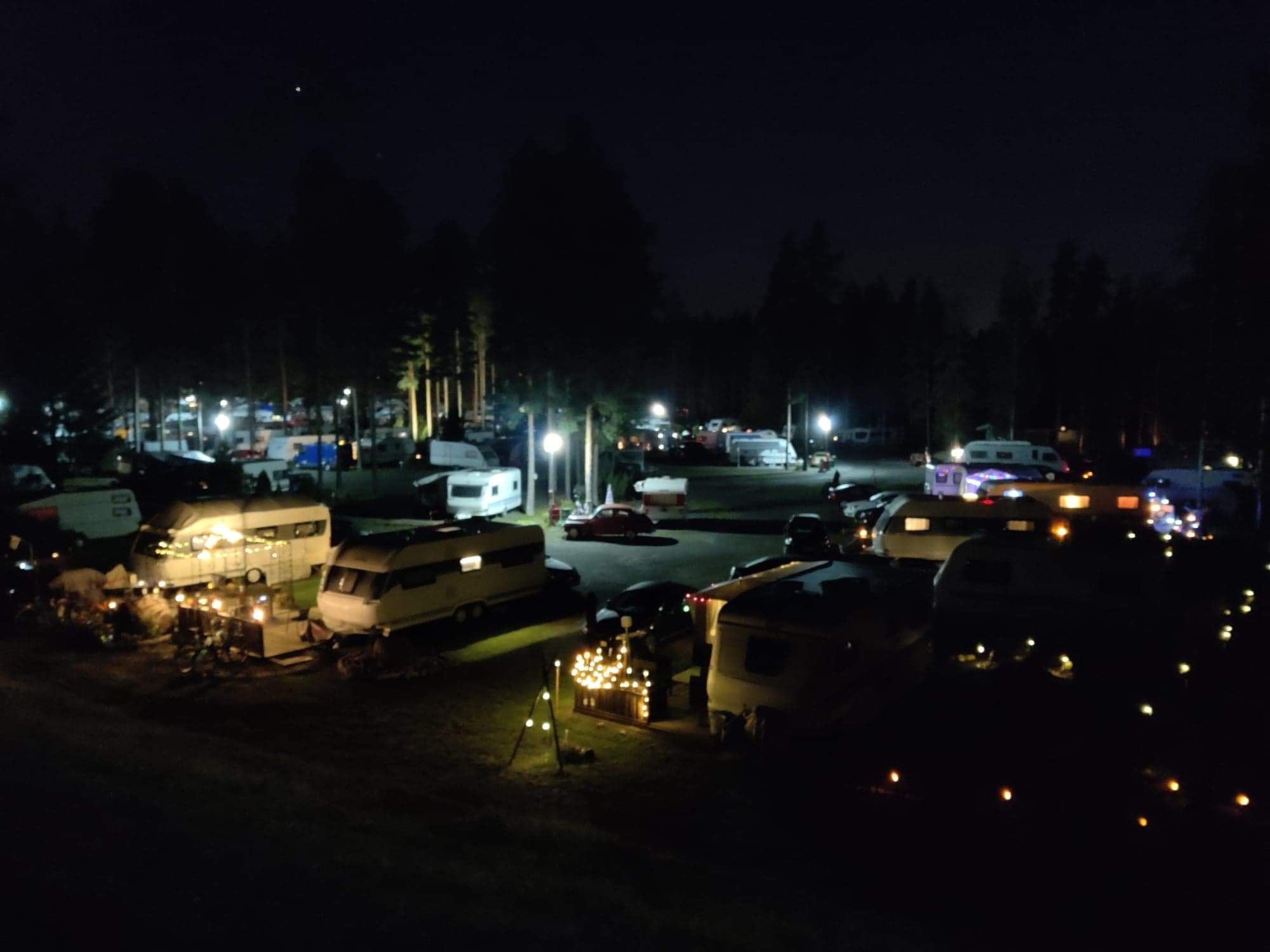 A view of SF-Caravan-Kalajärvi at night, lights from many caravans are visible in the dark