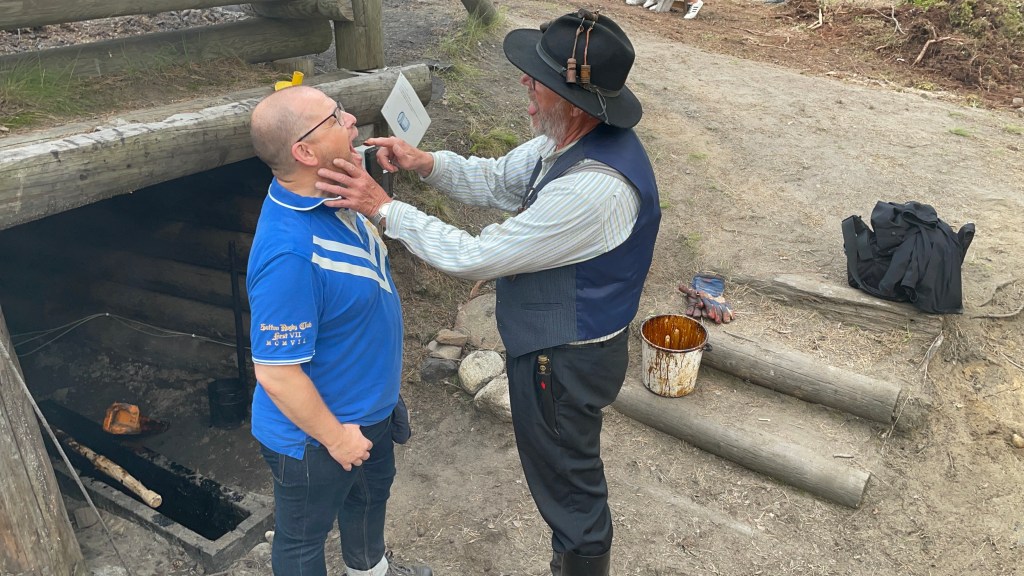 Mark having a spot of tar put onto the back of his tongue.